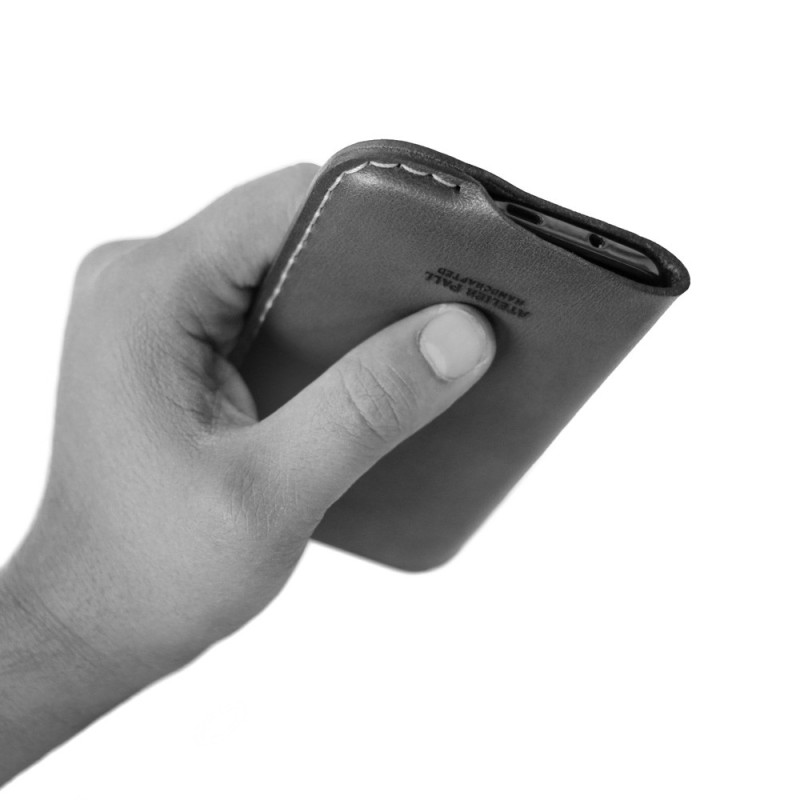 iPhone leather sleeve in hand